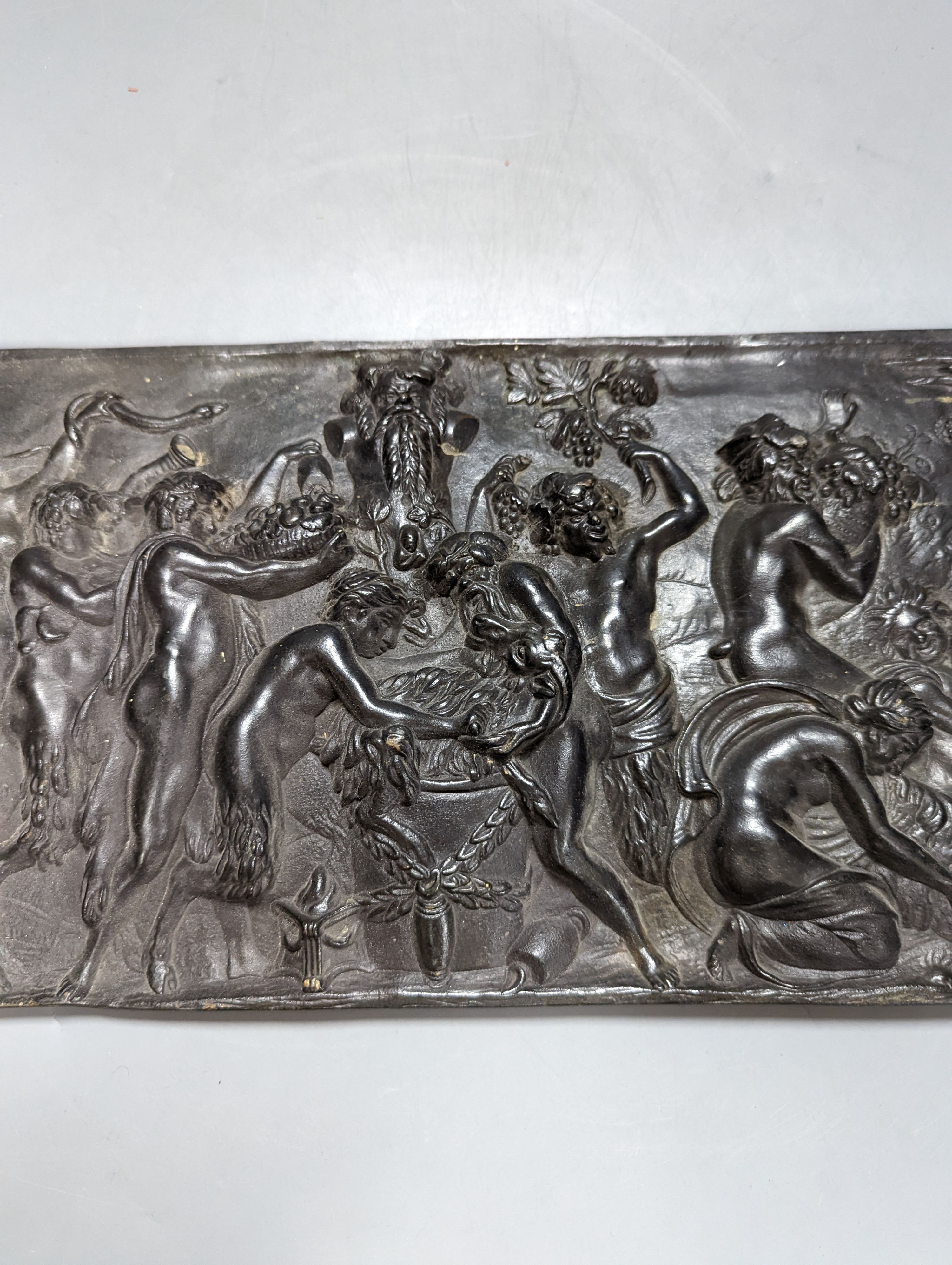 A 19th century cast bronze Bacchanalian plaque, 47 cms wide x20 high.